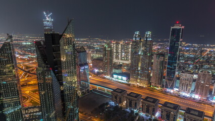 Fototapeta na wymiar High-rise buildings on Sheikh Zayed Road in Dubai aerial all night timelapse, UAE.
