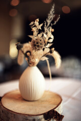 Beautiful dried flower bouquet in natural boho style with atmospheric bokeh. Sustainable decoration...