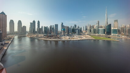 Cityscape with skyscrapers of Dubai Business Bay and water canal aerial timelapse.