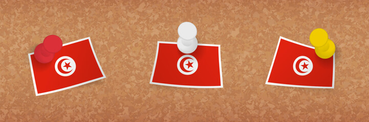 Tunisia flag pinned in cork board, three versions of Tunisia flag.