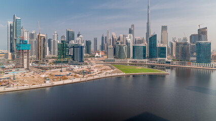 Aerial view to Dubai Business Bay and Downtown with the various skyscrapers and towers timelapse