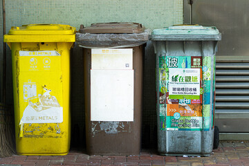 Old and worn-out recycling bins
