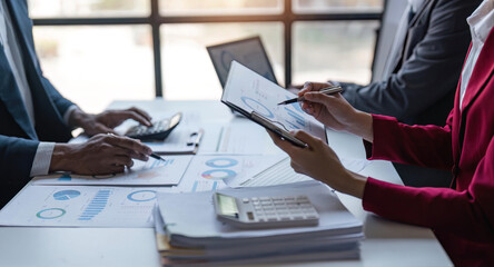 Atmosphere of company meeting, business team are meeting together to summarize and plan investment finances, they are the founders of the company. Business administration concept