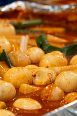Delicious Korean cuisine Tteokbokki, spicy rice cake in market, street food.