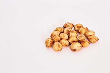 Side view of cherry pits on a white background. Close-up