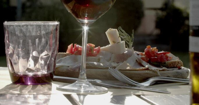 close up of Italian meal  with red wine on a table 