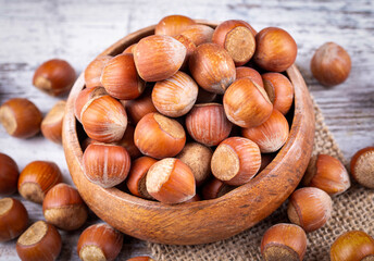 Shelled Hazelnuts is important for health on the wooden background