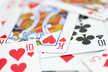 Intricate playing cards scattered on the table.
