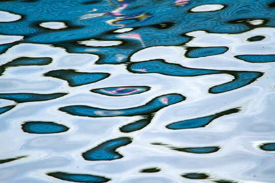 Abstract blue water reflection patterns.