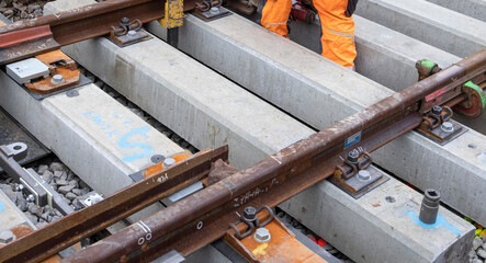 railway construction site with tools close up of rail attachment 