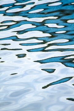 Abstract blue water reflection patterns.