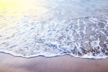 Naklejka na ściany i meble sea foam on the sand abstract background abstract water ocean