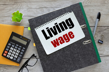 folder notebook. text on the page Living Wage