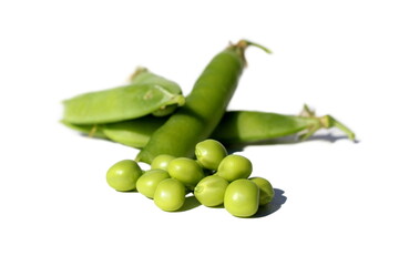 Green Peas pod and peas lie on a white isolated background.