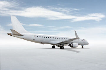 Fototapeta premium White passenger airplane isolated on bright background with sky