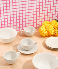 Beautiful table setting. Elegant dinnerware. Yellow bright beautiful flowers.