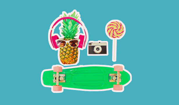 Fashion pineapple with headphones, sunglasses, lollipop caramel on stick and film camera, skateboard on colorful blue background, magazine style