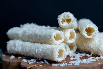 Waffle tubes with butter cream and coconut sprinkles