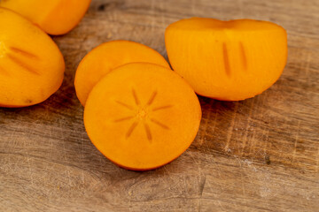 Half-ripe Orange persimmon, close up