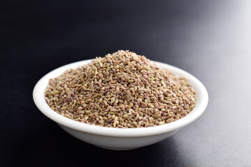 Closeup of ajwain seeds in dark background