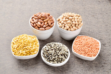Multiple raw pulses and legume in bowl on the table