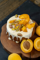 fresh yogurt with taste and chunks of yellow apricot