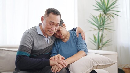 Asian elderly old couple embracing bonding comforting and express empathy. Elderly man caring wife...