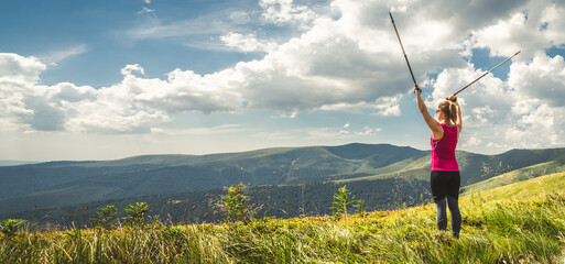 Young woman n the top of the mountains