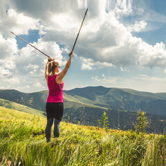 Young woman n the top of the mountains