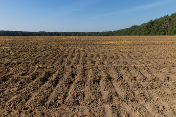 A plowed field with fertile soil for agricultural activities