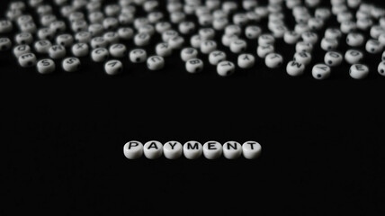 Word PAYMENT made with round blocks
