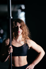 Obraz na płótnie Canvas Athletic Beautiful Woman Does her cross fitness at gym
