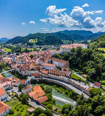 Fototapeta na wymiar An aerial view across the Selca Sora river and the old town in Skofja Loka, Slovenia in summertime 
