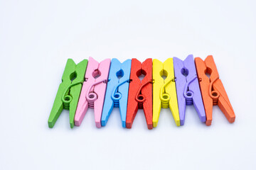 Multi colored clothes-pegs on white background, Clothes clip