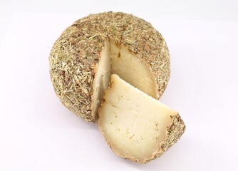 Pecorino aged in straw and hay. Cheese wheel and slice on white background.