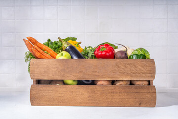 Farm organic market shopping concept, Wooden box with summer, autumn raw vegetables and fruits 