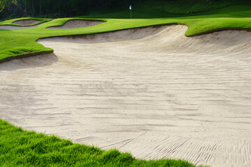 Golf Course Sand Pit Bunkers, green grass surrounding the beautiful sand holes is one of the most challenging obstacles for golfers and adds to the beauty of the golf course.