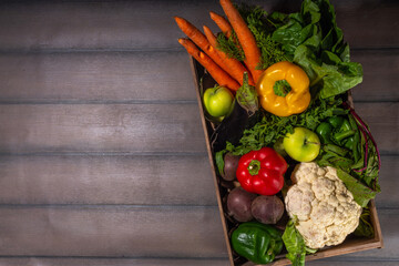 Farm organic market shopping concept, Wooden box with summer, autumn raw vegetables and fruits 