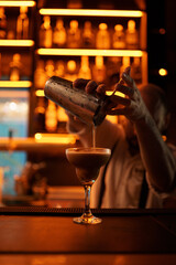 bartender pouring cocktail