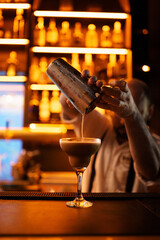 bartender pouring cocktail