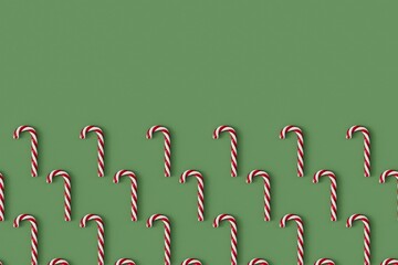 Christmas candy cane red and white festive sweet on a green background. 3D Rendering.