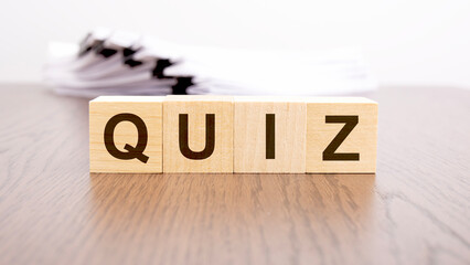 text QUIZ on wooden cubes, business analysis concept