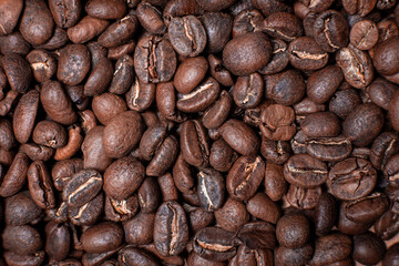 Coffee beans background with fair trade arabic roasted beans