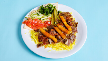 Beef portion doner kebab with rice in plate top view