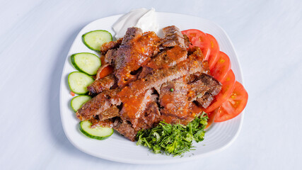 Beef portion doner kebab in plate top view