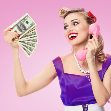 woman with money, talking on phone, dressed in pin-up style dress