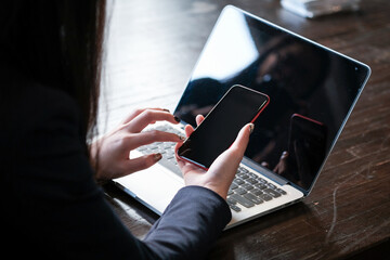 Women's hands holding cell telephone blank copy space screen. smart phone with technology concept.