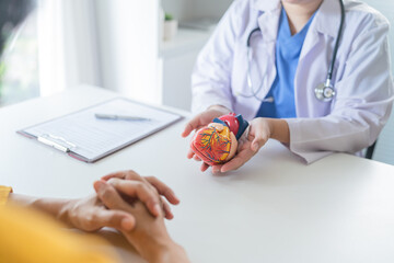 Cardiology Consultation treatment of heart disease. Doctor cardiologist while consultation showing...
