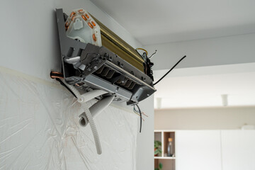 Installation air conditioning system on white wall in apartment, office closeup. Technology...