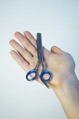 scissors in hand isolated